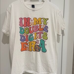 “In my double digit era” Gildan Softstyle White Tee
Size kids large